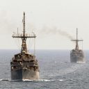 Which countries will send warships through the Strait of Hormuz by July 31?